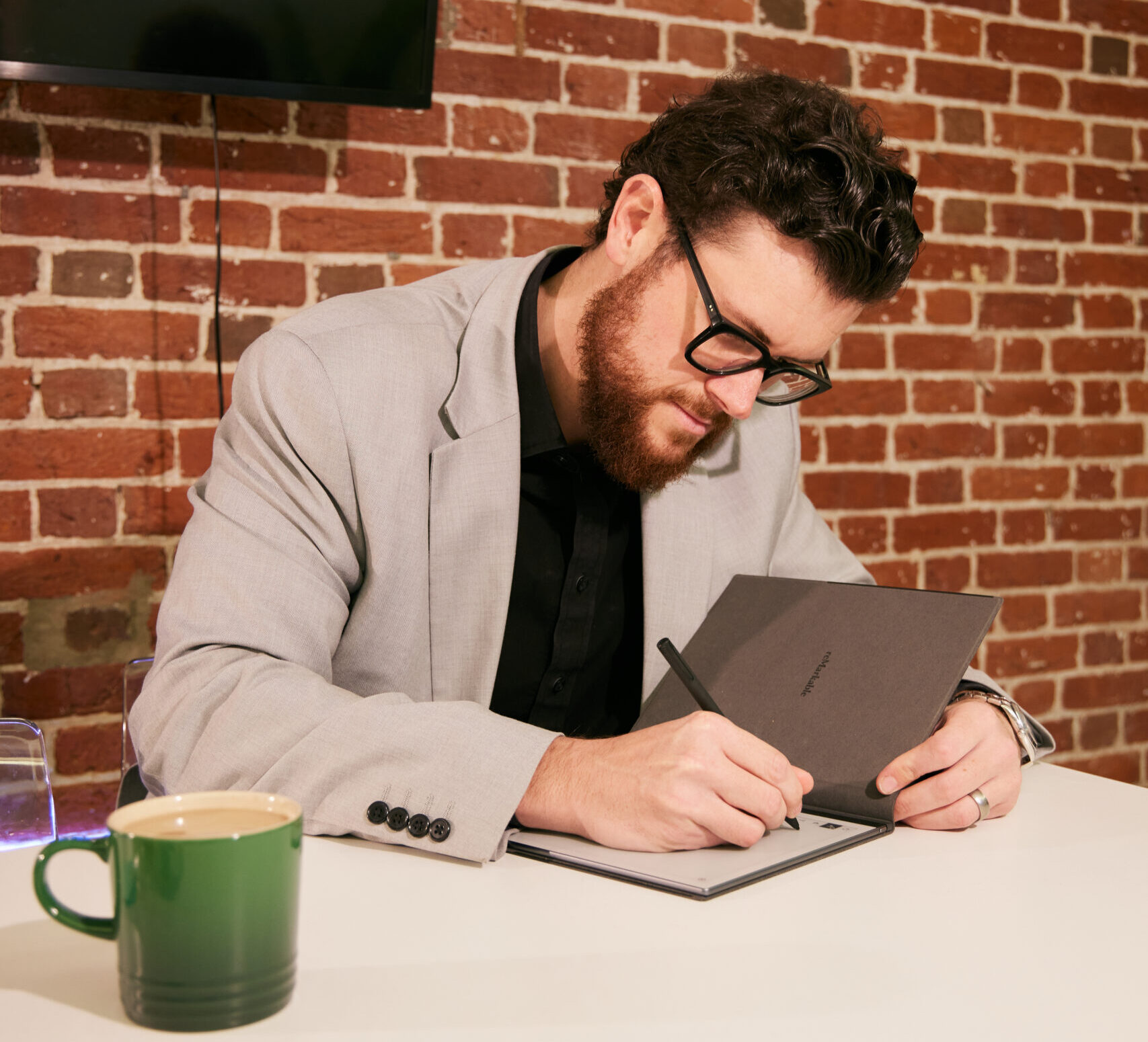 Josh Making Notes From Client Meeting for Mortgage In Principle